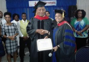 Student Receives Diploma